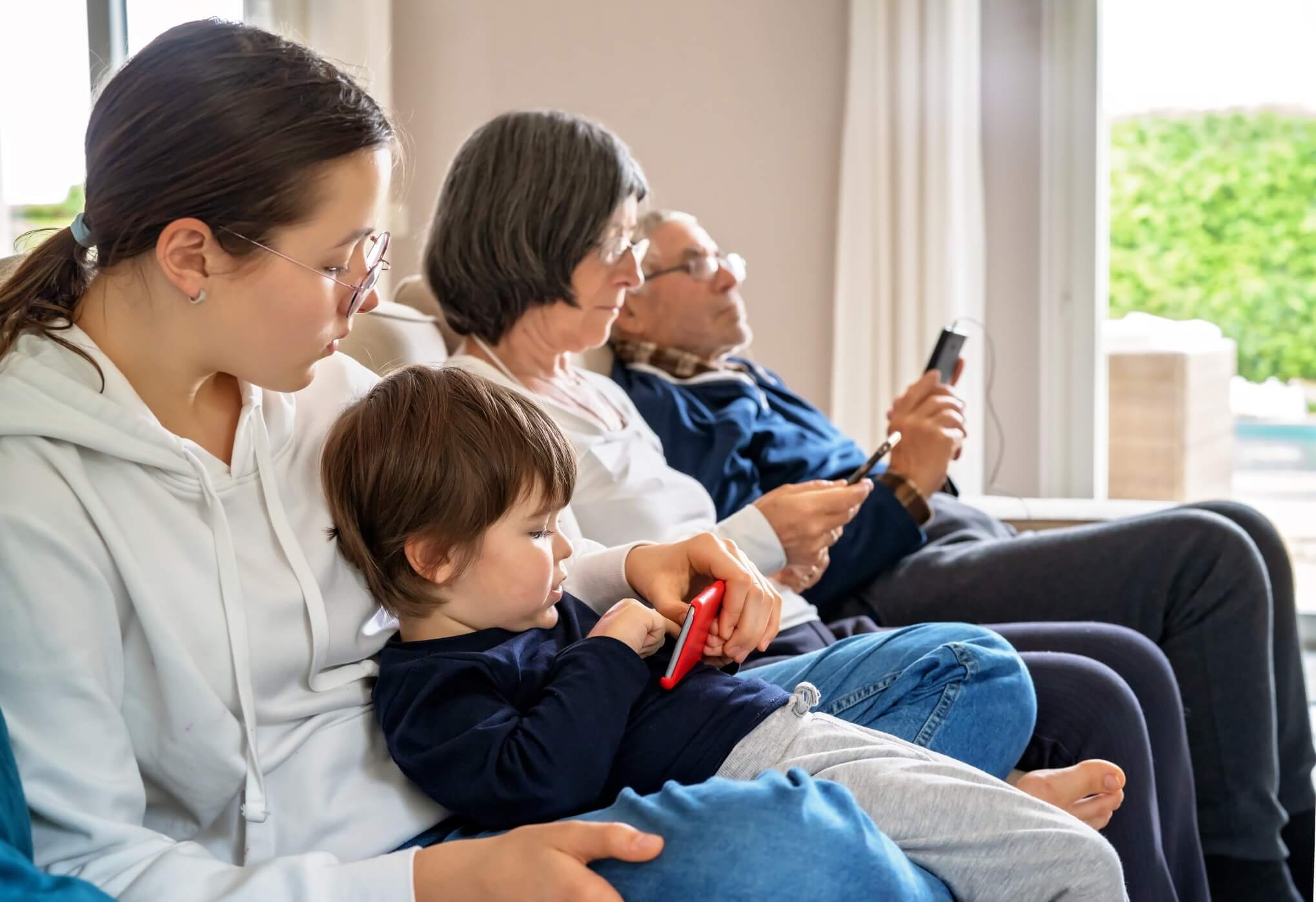 modern-family-lifestyle-senior-white-hair-grandparents-and-grandchildren-sitting-on-couch-with_t20_9k0rbO (1)